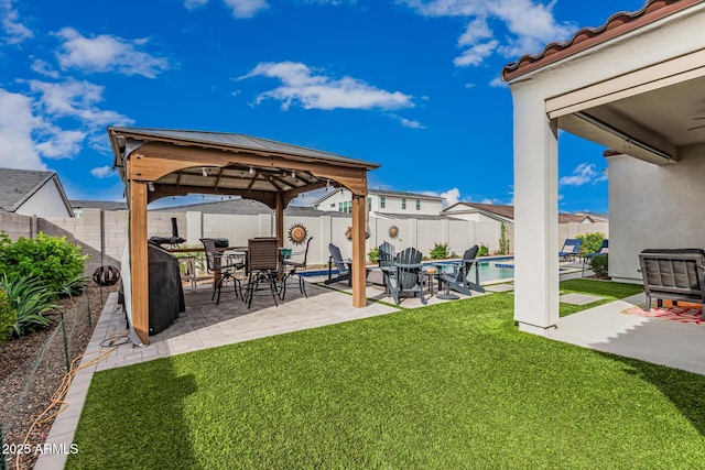 view of yard with a gazebo, a patio area, a fenced in pool, and a fenced backyard