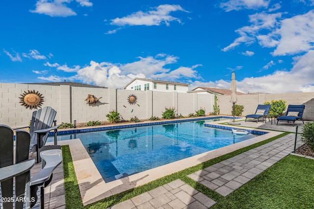 view of pool with a patio area, a fenced in pool, and a fenced backyard