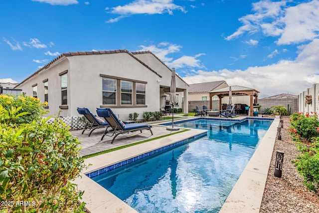 view of pool featuring a gazebo, a patio area, a fenced backyard, and a fenced in pool