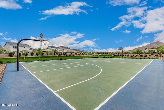 view of sport court featuring community basketball court and a residential view