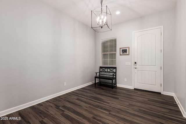 interior space with recessed lighting, baseboards, dark wood-type flooring, and a chandelier