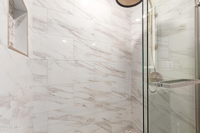 full bath featuring a marble finish shower