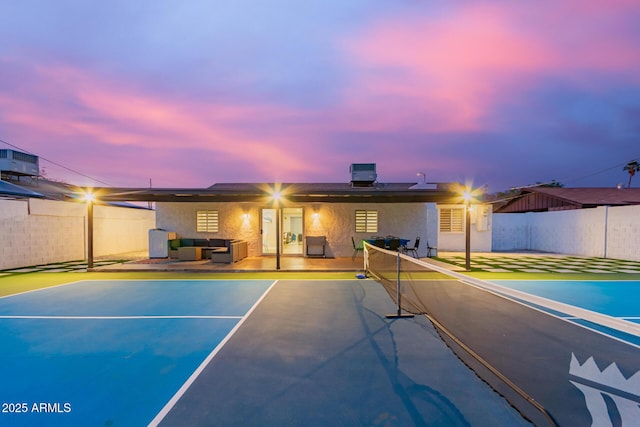 rear view of house with an outdoor hangout area, a fenced backyard, stucco siding, and a patio area