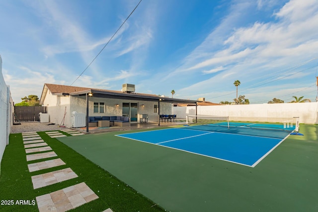 view of sport court with a fenced backyard