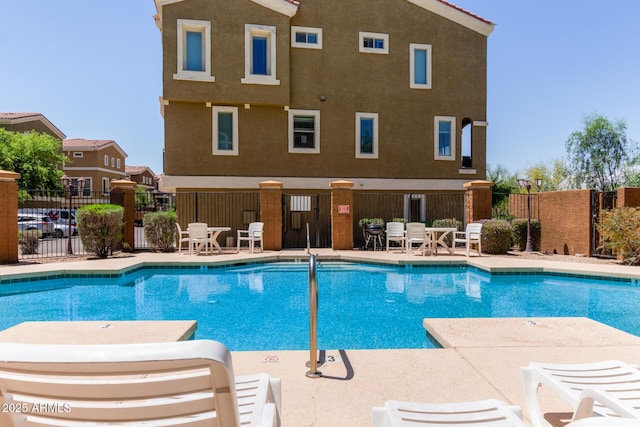 community pool featuring fence