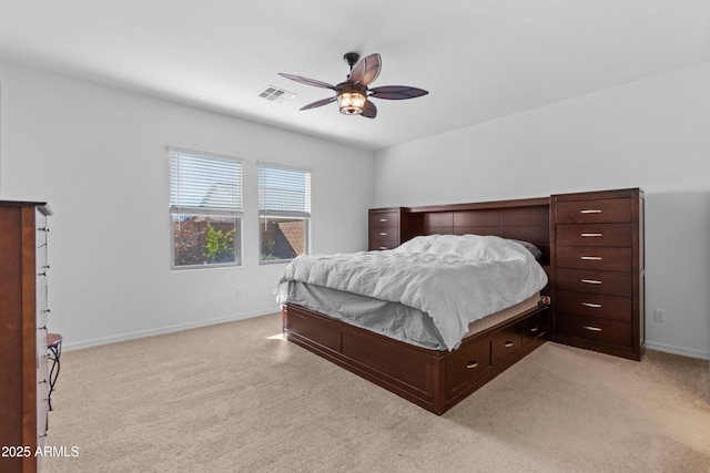 bedroom with baseboards, visible vents, ceiling fan, and light colored carpet