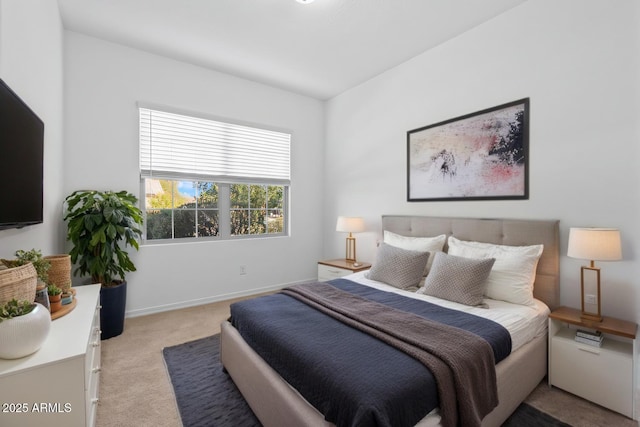 carpeted bedroom featuring baseboards