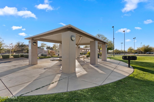 view of home's community featuring a gazebo, a yard, a patio area, and fence