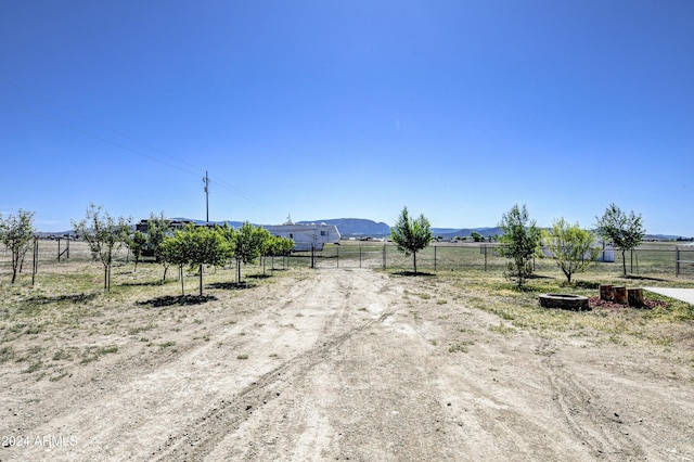 view of road with a mountain view and a rural view