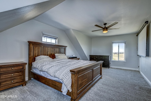 bedroom featuring ceiling fan, carpet, and vaulted ceiling