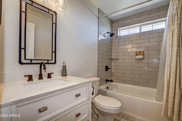 full bathroom with vanity, shower / tub combo, and toilet