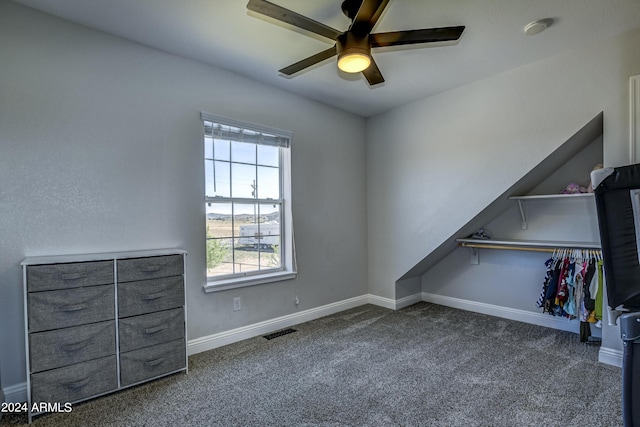 unfurnished bedroom featuring ceiling fan and carpet floors