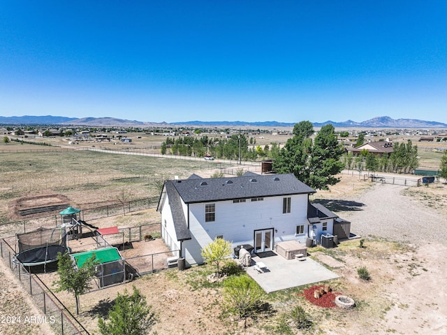 drone / aerial view with a mountain view and a rural view