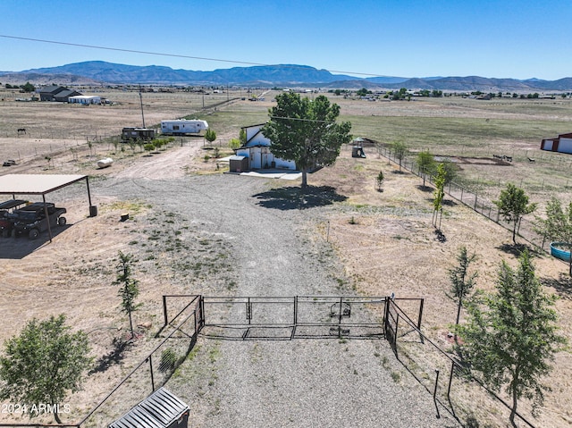 birds eye view of property with a mountain view and a rural view