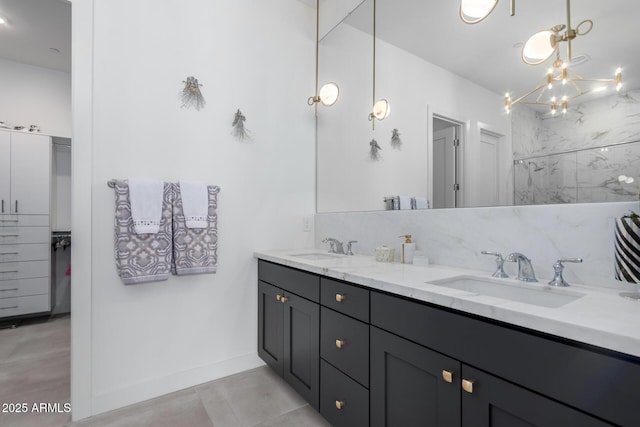 bathroom featuring vanity and a notable chandelier