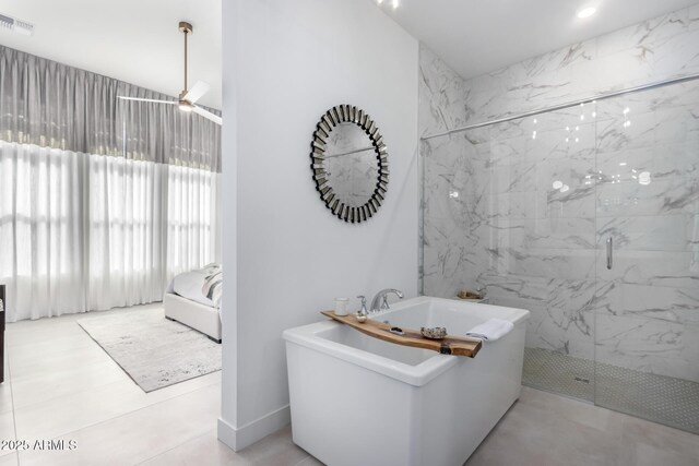 bathroom featuring ceiling fan, tile patterned floors, and independent shower and bath