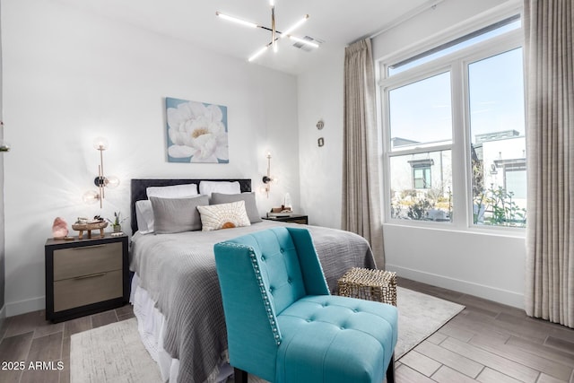 bedroom with a notable chandelier