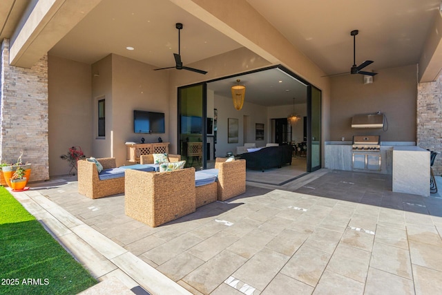 view of patio with ceiling fan, an outdoor kitchen, outdoor lounge area, and area for grilling