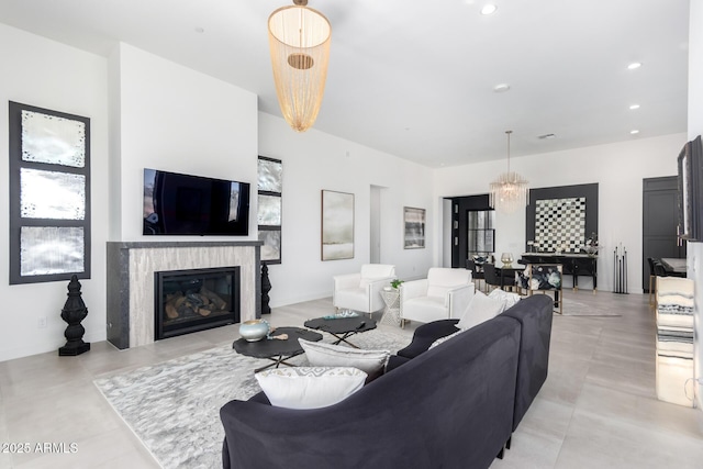 living room featuring a notable chandelier