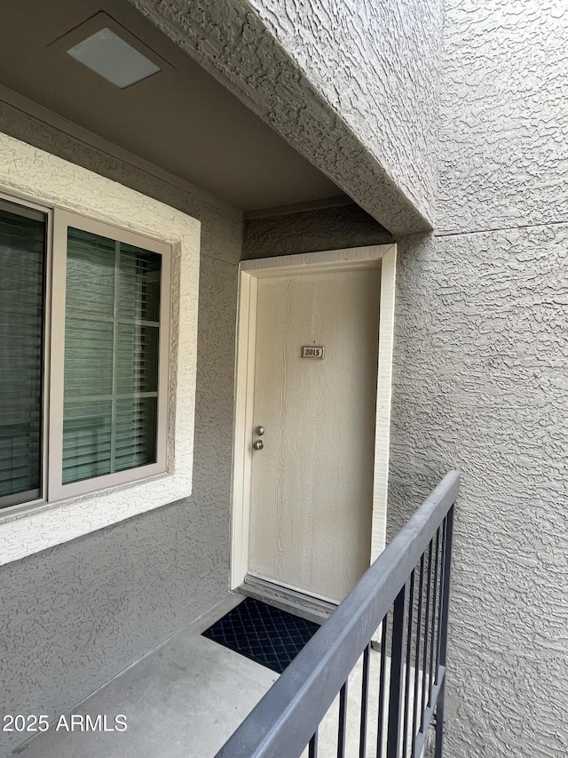 doorway to property featuring a balcony