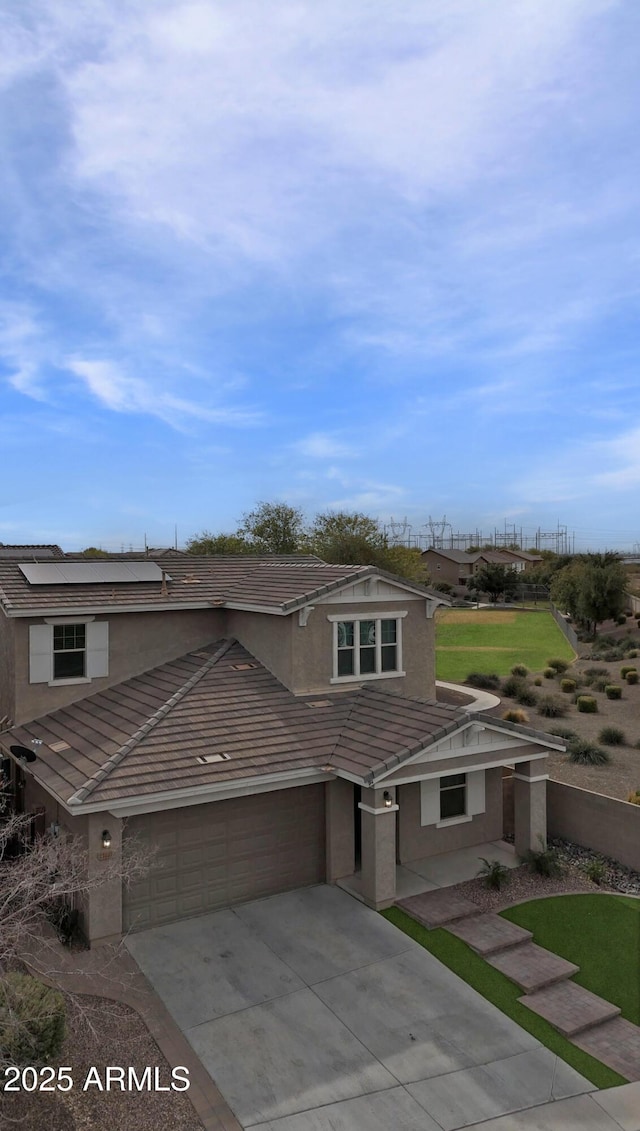 view of front of property featuring a garage