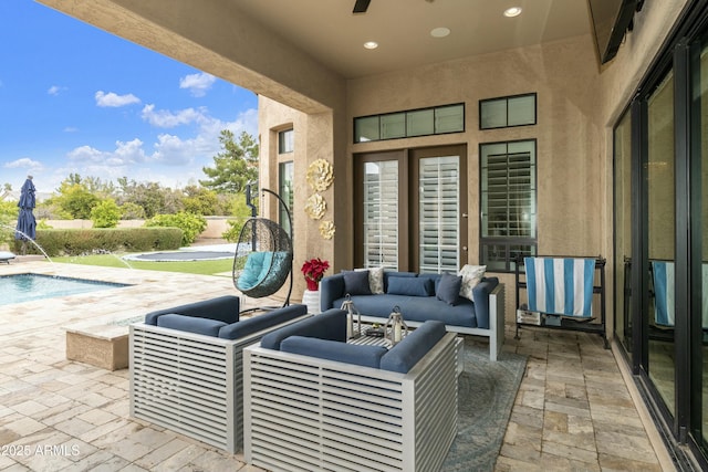 view of patio with an outdoor pool and outdoor lounge area