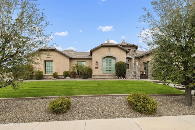 view of front facade featuring stone siding, stucco siding, a tiled roof, and a front yard