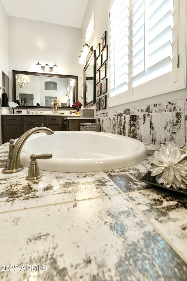 bathroom featuring a bath and vanity