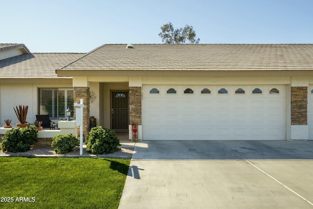 single story home featuring a garage and a front yard