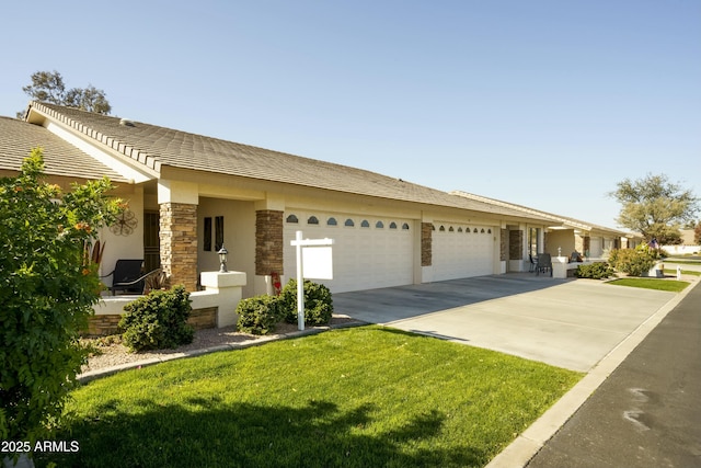 ranch-style house with a garage and a front lawn