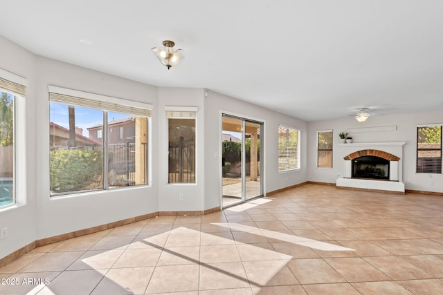 unfurnished living room featuring light tile patterned floors