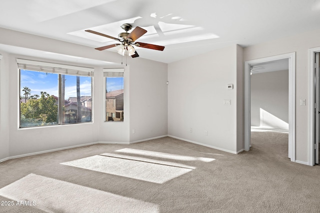 spare room with light carpet and ceiling fan