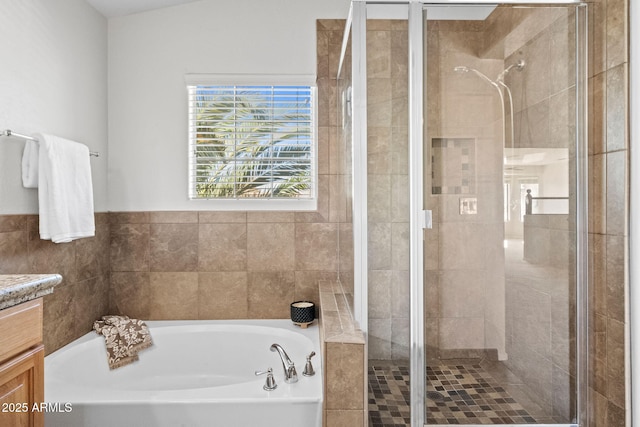 bathroom featuring vanity and plus walk in shower