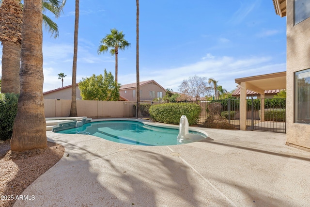 view of pool with a patio and an in ground hot tub