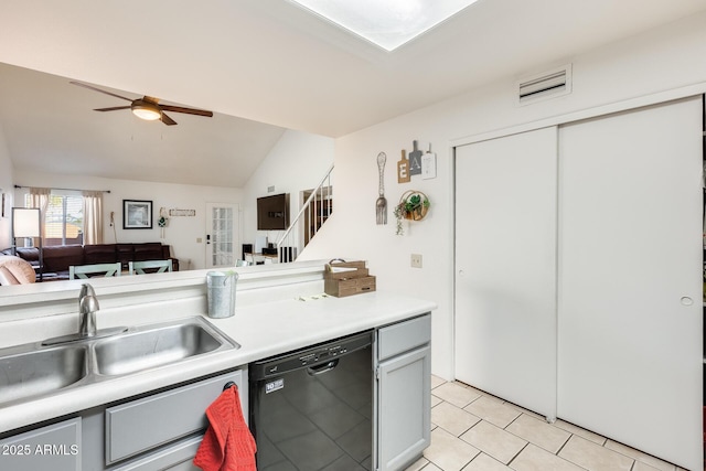 kitchen featuring visible vents, a sink, light countertops, black dishwasher, and open floor plan