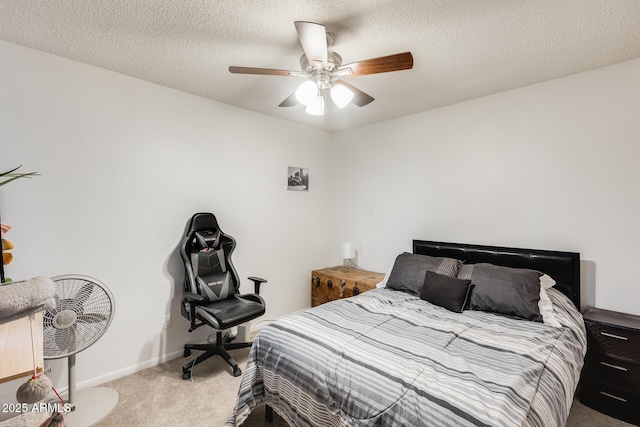 bedroom featuring baseboards, ceiling fan, a textured ceiling, and carpet