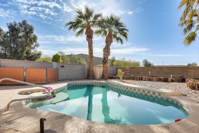 view of swimming pool with a patio, a fenced backyard, and a fenced in pool