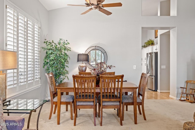 4462 E Dale Ln, Cave Creek, AZ 85331 - dining area featuring ceiling fan, light colored carpet, a high ceiling, and baseboards