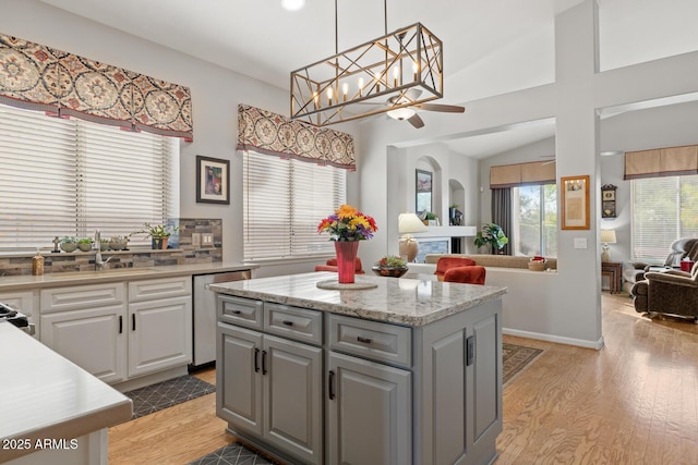 4462 E Dale Ln, Cave Creek, AZ 85331 - kitchen with a sink, light wood-type flooring, ceiling fan, white cabinetry, and lofted ceiling