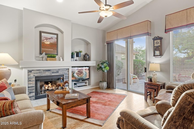 4462 E Dale Ln, Cave Creek, AZ 85331 - living area with a fireplace, lofted ceiling, a ceiling fan, healthy amount of natural light, and light wood-type flooring