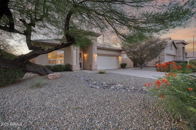 4462 E Dale Ln, Cave Creek, AZ 85331 - view of front facade featuring stucco siding, an attached garage, a tiled roof, and concrete driveway