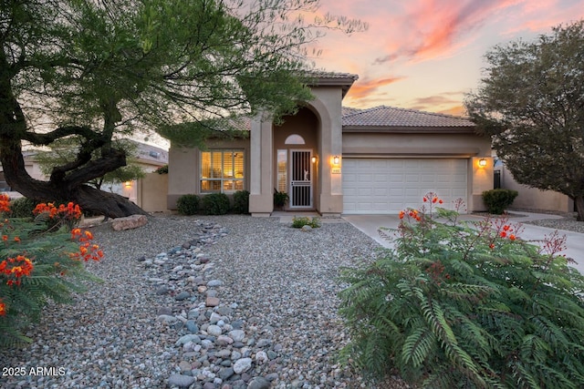 4462 E Dale Ln, Cave Creek, AZ 85331 - mediterranean / spanish home featuring stucco siding, a garage, concrete driveway, and a tile roof