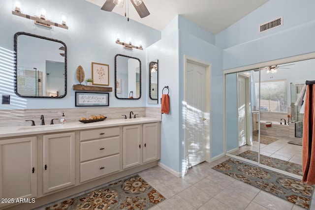 4462 E Dale Ln, Cave Creek, AZ 85331 - full bathroom featuring ceiling fan, double vanity, tile patterned flooring, and a tub