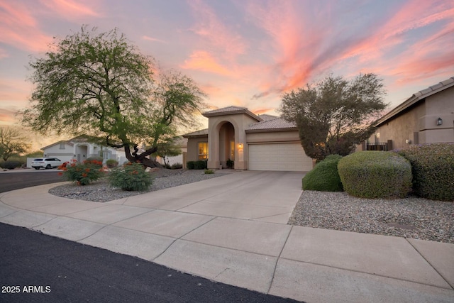 4462 E Dale Ln, Cave Creek, AZ 85331 - view of front of home featuring an attached garage, driveway, a tile roof, and stucco siding