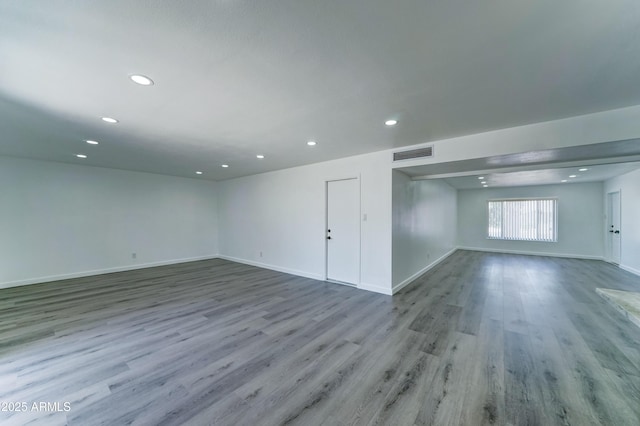 basement featuring wood finished floors, recessed lighting, and baseboards