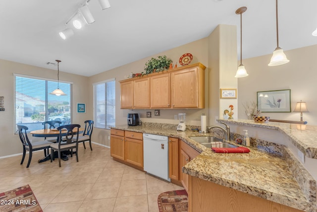 kitchen featuring sink, hanging light fixtures, kitchen peninsula, white dishwasher, and light tile patterned floors