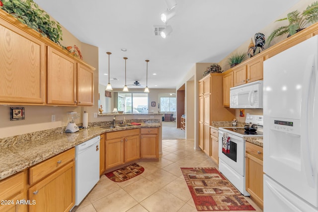 kitchen with pendant lighting, white appliances, sink, light stone counters, and kitchen peninsula