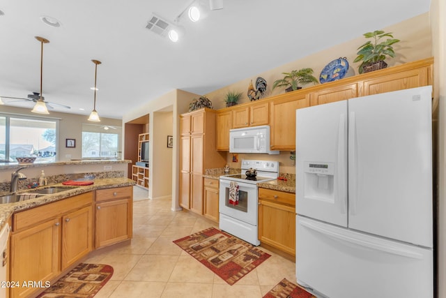 kitchen with light stone counters, white appliances, ceiling fan, sink, and light tile patterned floors