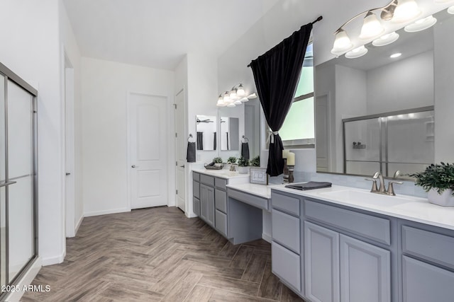 bathroom featuring vanity, parquet flooring, and walk in shower