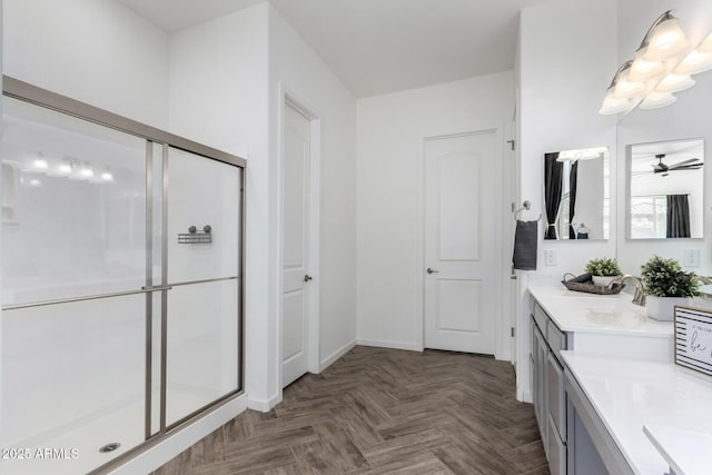 bathroom with vanity, parquet floors, and a shower with shower door